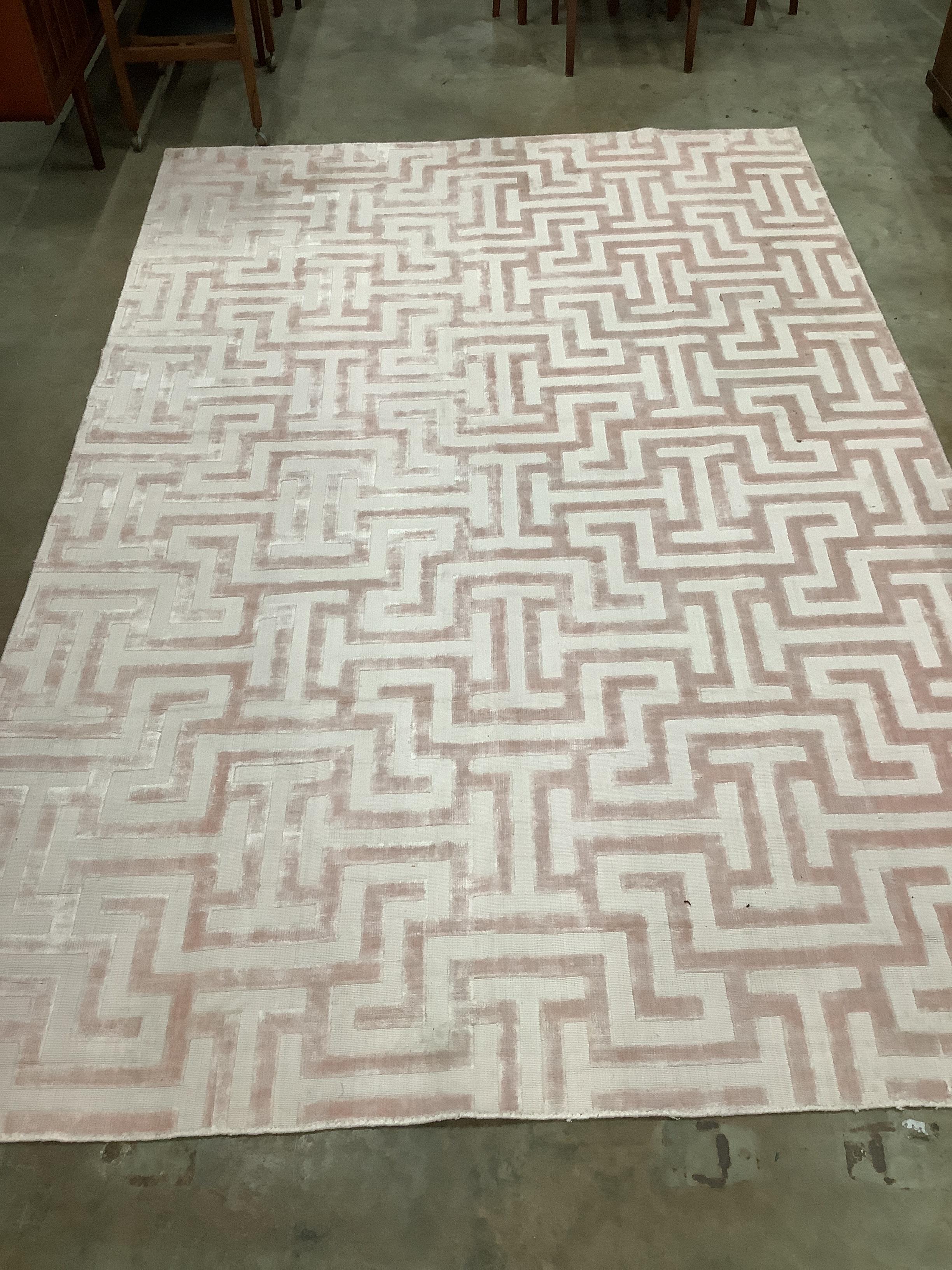 A contemporary part silk peach geometric carpet, 300 x 200cm